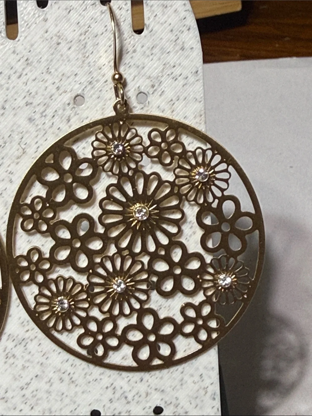 Gold tone dangle floral & rhinestone cut out pierced earrings
